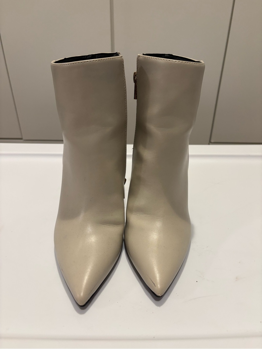 Sleek Pointed-Toe Ankle Booties in Cream